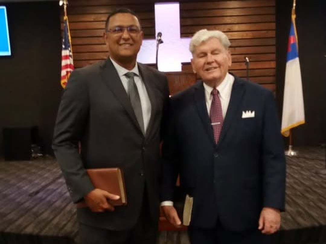 Pastor Mickey Carter standing with Pastor Kelly in the sanctuary