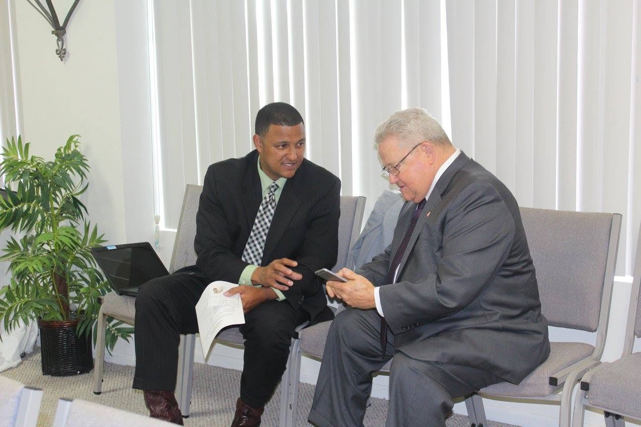 Pastor Kelly and Brother Smith talking together at the church